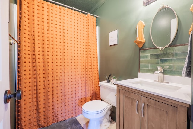 bathroom with vanity, ornamental molding, curtained shower, tile patterned floors, and toilet