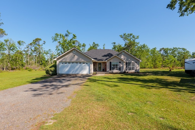 ranch-style house with an attached garage, gravel driveway, and a front lawn