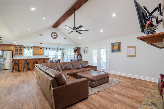 living room with high vaulted ceiling, ceiling fan, light wood-style flooring, recessed lighting, and beam ceiling