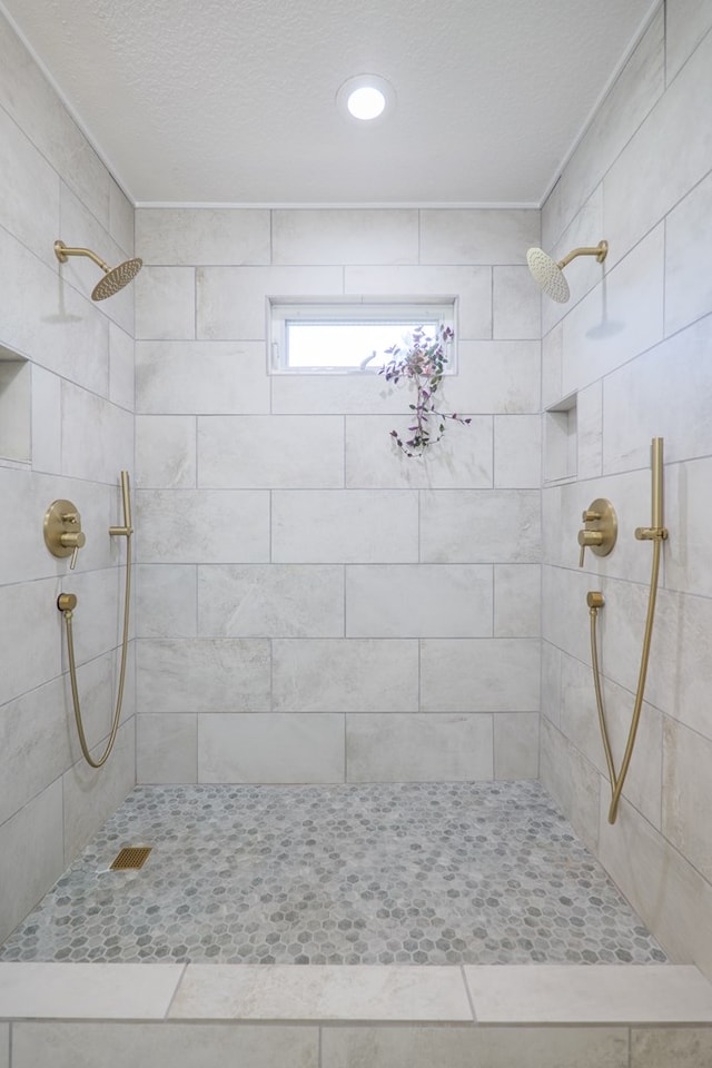 full bath featuring tiled shower
