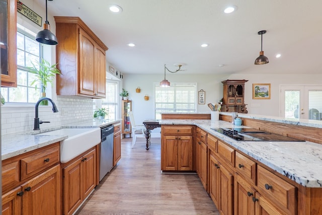 kitchen featuring a sink, stainless steel dishwasher, recessed lighting, and black electric cooktop
