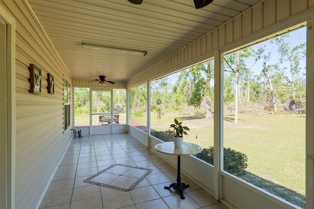 sunroom with ceiling fan and a wealth of natural light