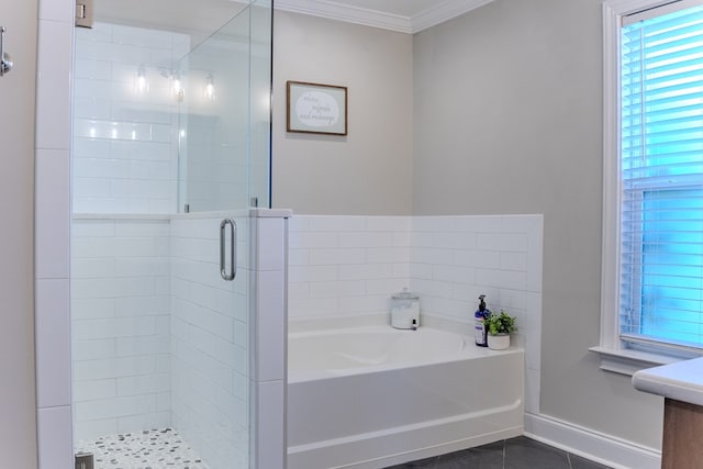 bathroom featuring a stall shower, ornamental molding, tile patterned floors, a garden tub, and vanity