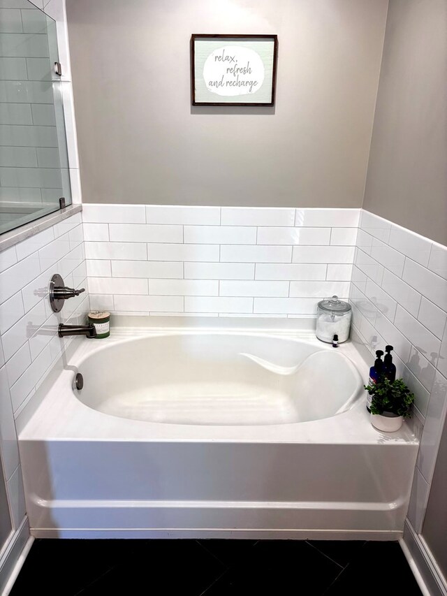 full bath with a garden tub