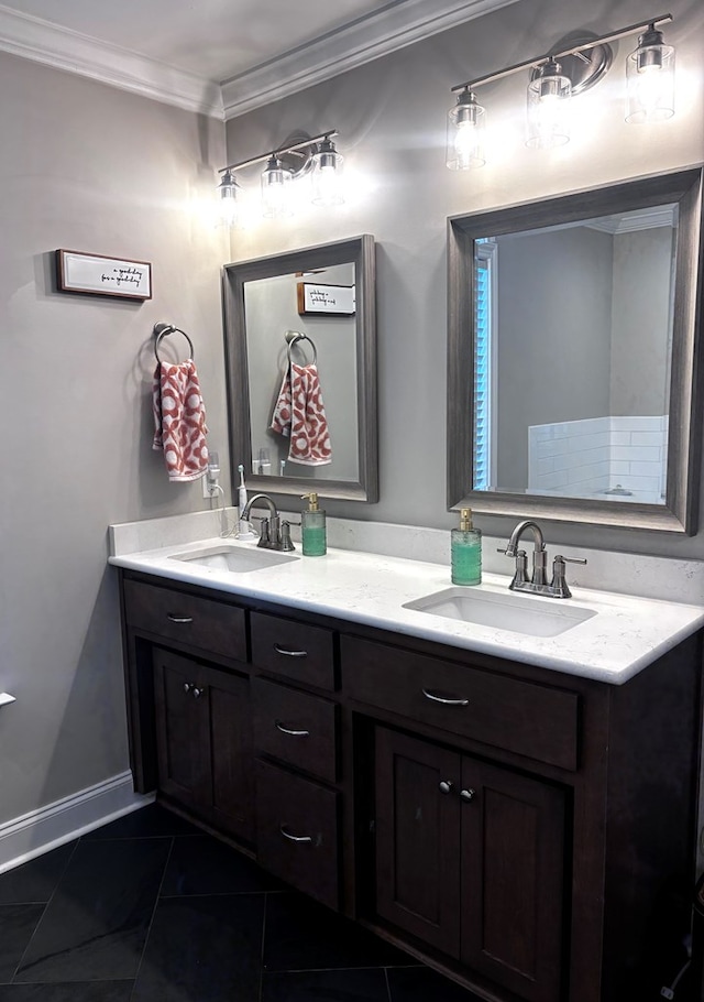 full bath with double vanity, tile patterned floors, crown molding, and a sink