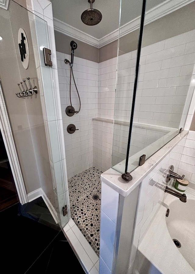 bathroom featuring a stall shower and ornamental molding