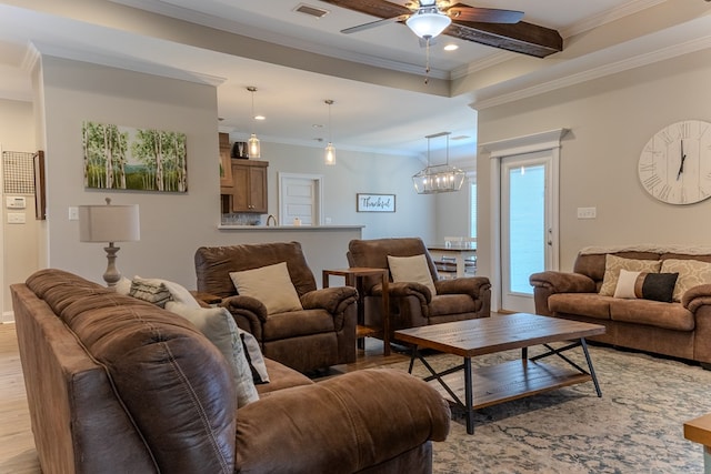 living room featuring crown molding, ceiling fan, visible vents, light wood-type flooring, and recessed lighting