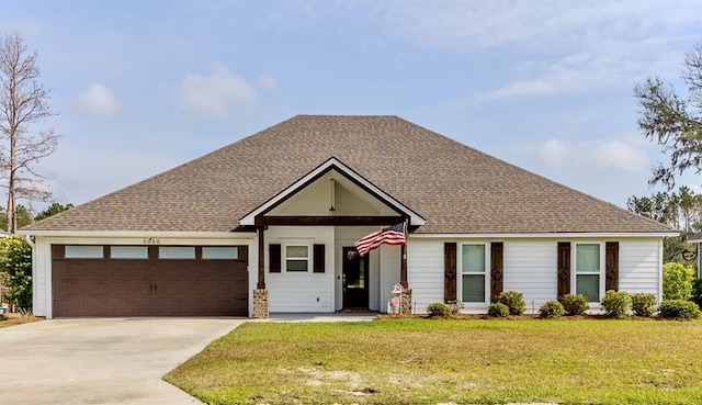 ranch-style house with a front lawn, concrete driveway, and an attached garage
