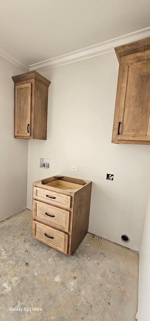 laundry room with crown molding