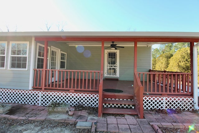 property entrance with ceiling fan