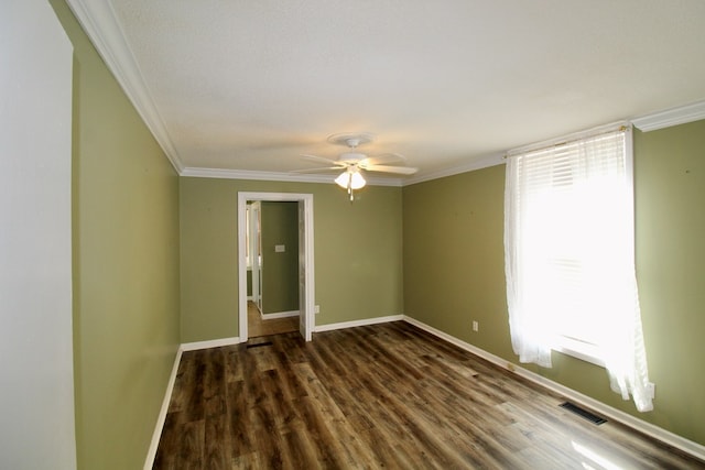 unfurnished room with ceiling fan, ornamental molding, dark hardwood / wood-style floors, and a wealth of natural light