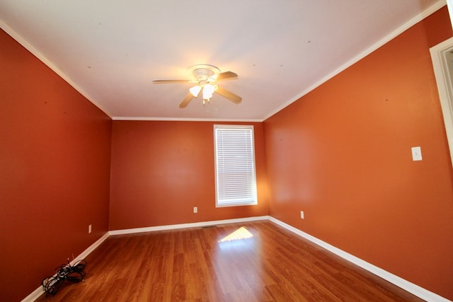 spare room with crown molding, ceiling fan, and hardwood / wood-style floors