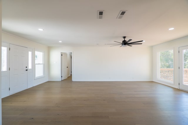 entrance foyer with crown molding, recessed lighting, wood finished floors, and visible vents