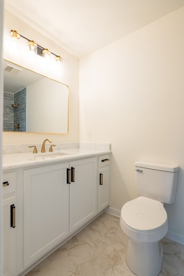 bathroom featuring visible vents, marble finish floor, vanity, and toilet