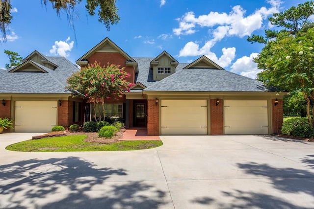 4059 Live Oaks Cir, Valdosta, GA 31601 - view of front of property with a shingled roof, brick siding, concrete driveway, and a garage