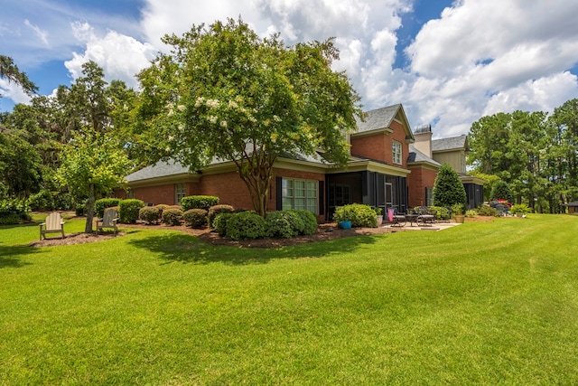 4059 Live Oaks Cir, Valdosta, GA 31601 - view of grassy yard with a patio area