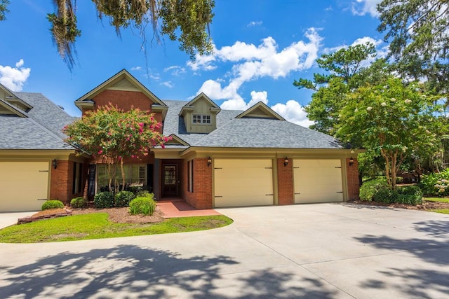4059 Live Oaks Cir, Valdosta, GA 31601 - view of front of property featuring brick siding, concrete driveway, a garage, and roof with shingles