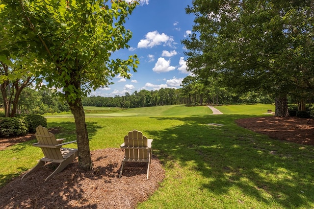 4059 Live Oaks Cir, Valdosta, GA 31601 - view of grassy yard with view of golf course and view of wooded area