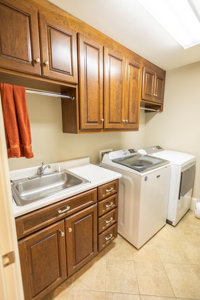 4059 Live Oaks Cir, Valdosta, GA 31601 - laundry room featuring cabinet space, separate washer and dryer, and light tile patterned floors