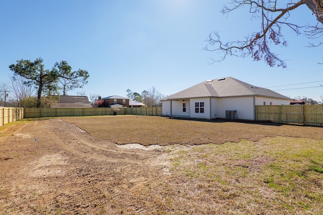 view of yard with a fenced backyard and cooling unit