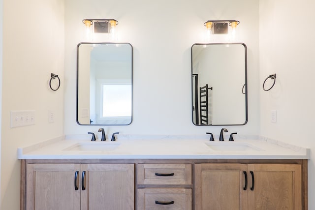 bathroom with double vanity and a sink