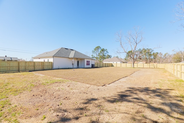 exterior space with a fenced backyard