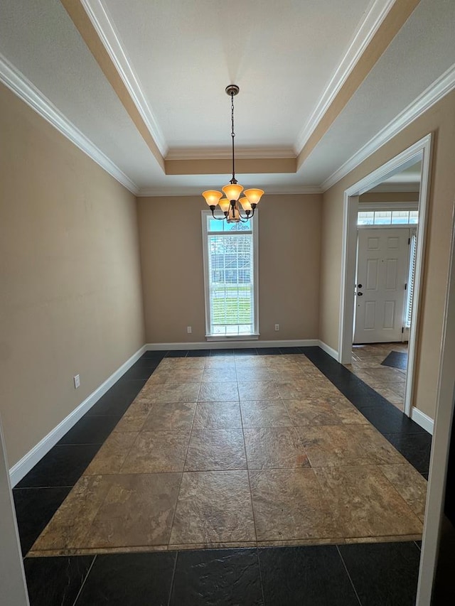 empty room featuring baseboards, a raised ceiling, a chandelier, and ornamental molding