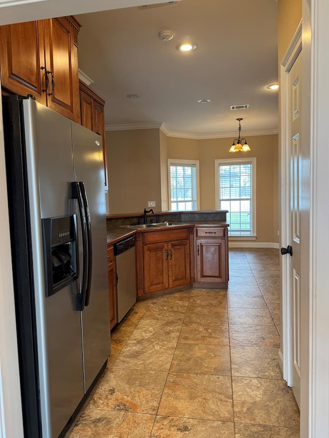 kitchen with dark countertops, crown molding, visible vents, and appliances with stainless steel finishes