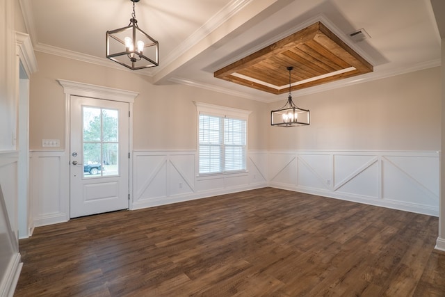 unfurnished dining area featuring a chandelier, dark hardwood / wood-style floors, and ornamental molding