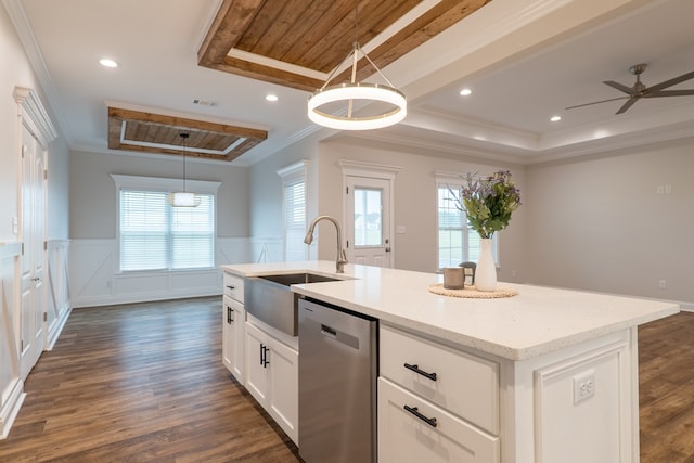 kitchen with dishwasher, a kitchen island with sink, white cabinets, hanging light fixtures, and dark hardwood / wood-style flooring