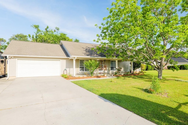 ranch-style home featuring driveway, a front lawn, and a garage