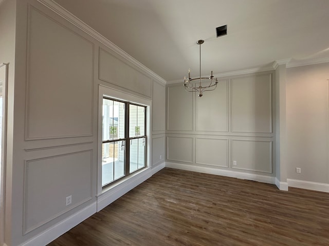 unfurnished dining area with dark hardwood / wood-style floors, crown molding, and a notable chandelier