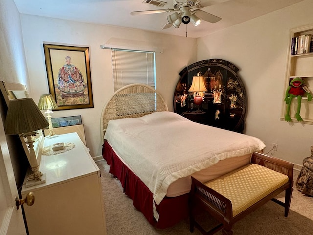 bedroom featuring ceiling fan and carpet