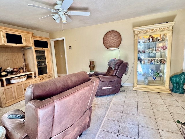 living room with light tile patterned flooring and ceiling fan