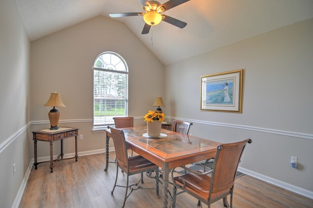 4121 Amberley Trl, Valdosta, GA 31602 - dining area featuring wood finished floors, a ceiling fan, and lofted ceiling