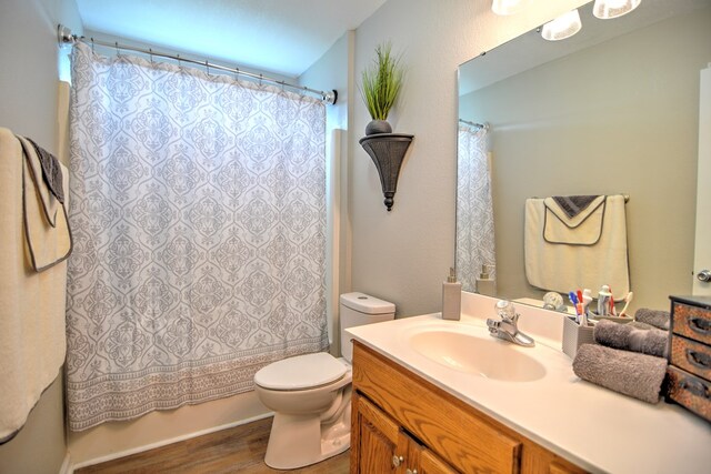 4121 Amberley Trl, Valdosta, GA 31602 - bathroom featuring wood finished floors, vanity, and shower / tub combo with curtain