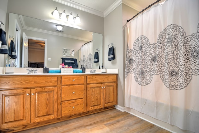4121 Amberley Trl, Valdosta, GA 31602 - full bathroom with wood finished floors, double vanity, and ornamental molding