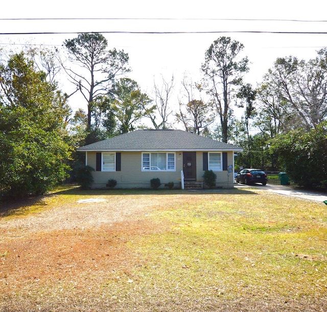 ranch-style house with a front lawn