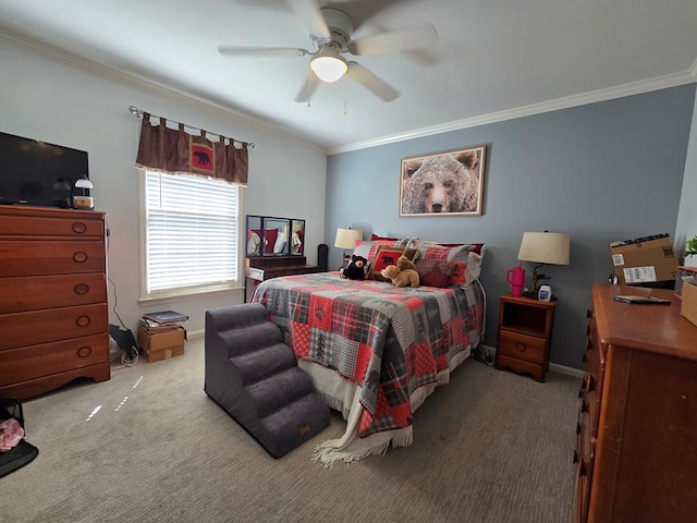 bedroom featuring a ceiling fan, carpet flooring, crown molding, and baseboards