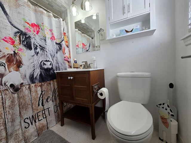 full bathroom with toilet, tile patterned floors, a shower with shower curtain, and vanity