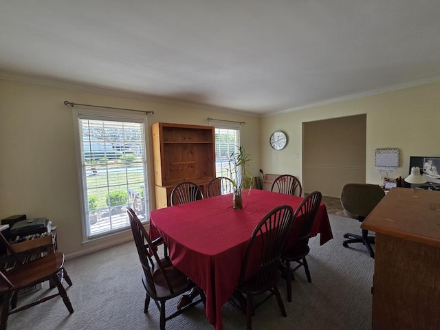 dining space featuring light carpet and ornamental molding