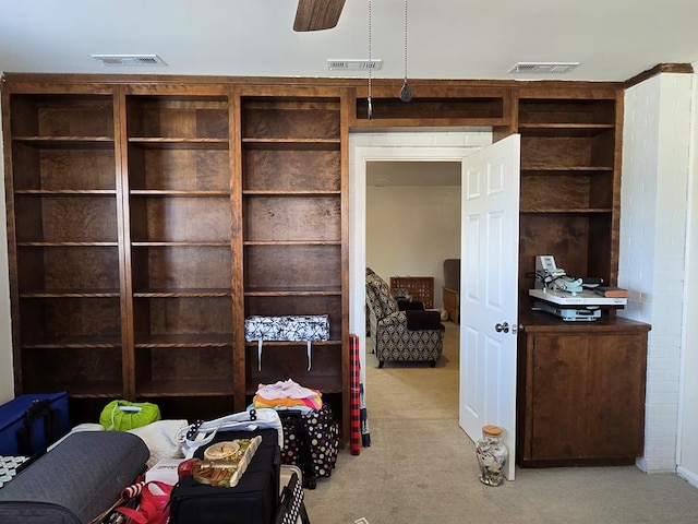 bedroom featuring visible vents and light colored carpet