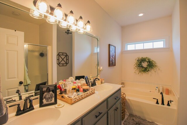 5300 Hidden Oaks Blvd, Lake Park, GA 31636 - full bath with double vanity, a shower stall, a bath, and recessed lighting