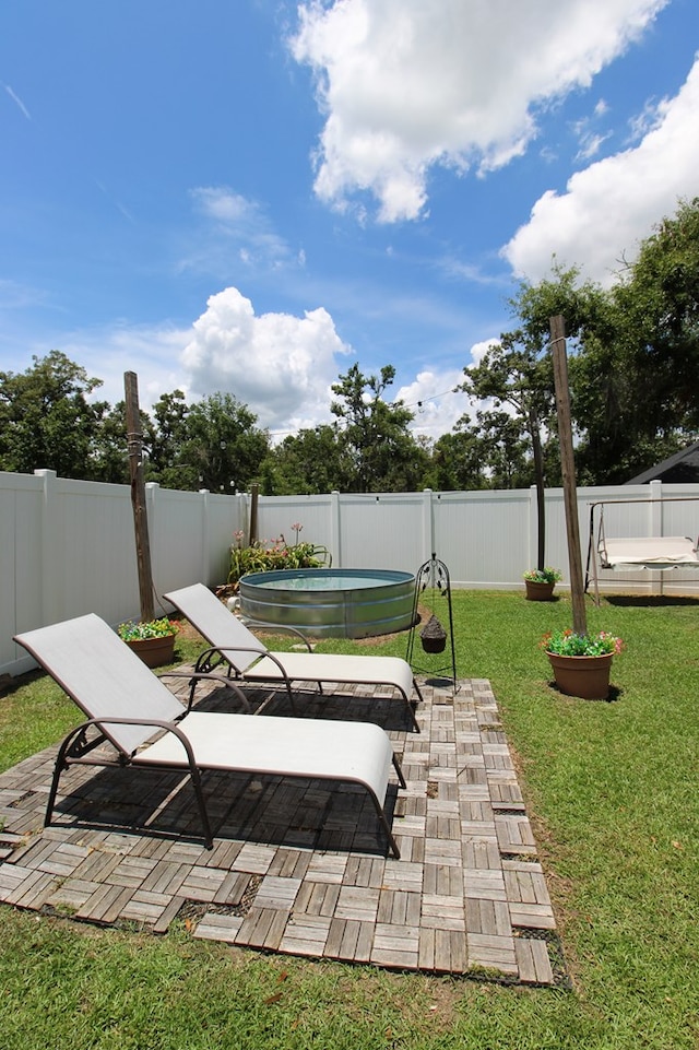 5300 Hidden Oaks Blvd, Lake Park, GA 31636 - fenced backyard with a patio area