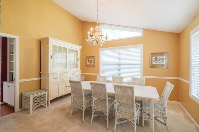 3564 River Chase Dr, Valdosta, GA 31602 - dining space featuring a chandelier, light colored carpet, plenty of natural light, high vaulted ceiling, and baseboards
