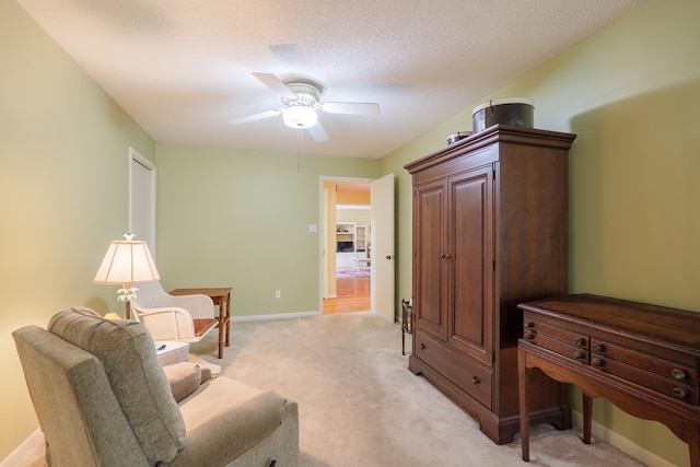 3564 River Chase Dr, Valdosta, GA 31602 - sitting room with a ceiling fan, light colored carpet, and baseboards