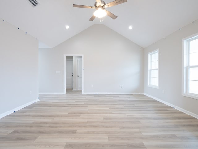 unfurnished room with a ceiling fan, recessed lighting, plenty of natural light, vaulted ceiling, and light wood-style flooring