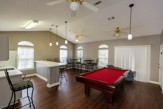 recreation room with lofted ceiling, dark hardwood / wood-style floors, a healthy amount of sunlight, and pool table