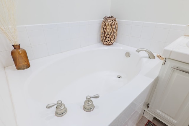 bathroom with a relaxing tiled tub