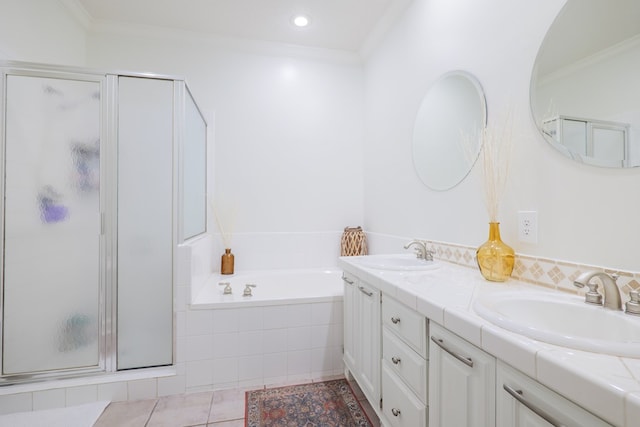 bathroom featuring tile patterned flooring, vanity, separate shower and tub, and crown molding